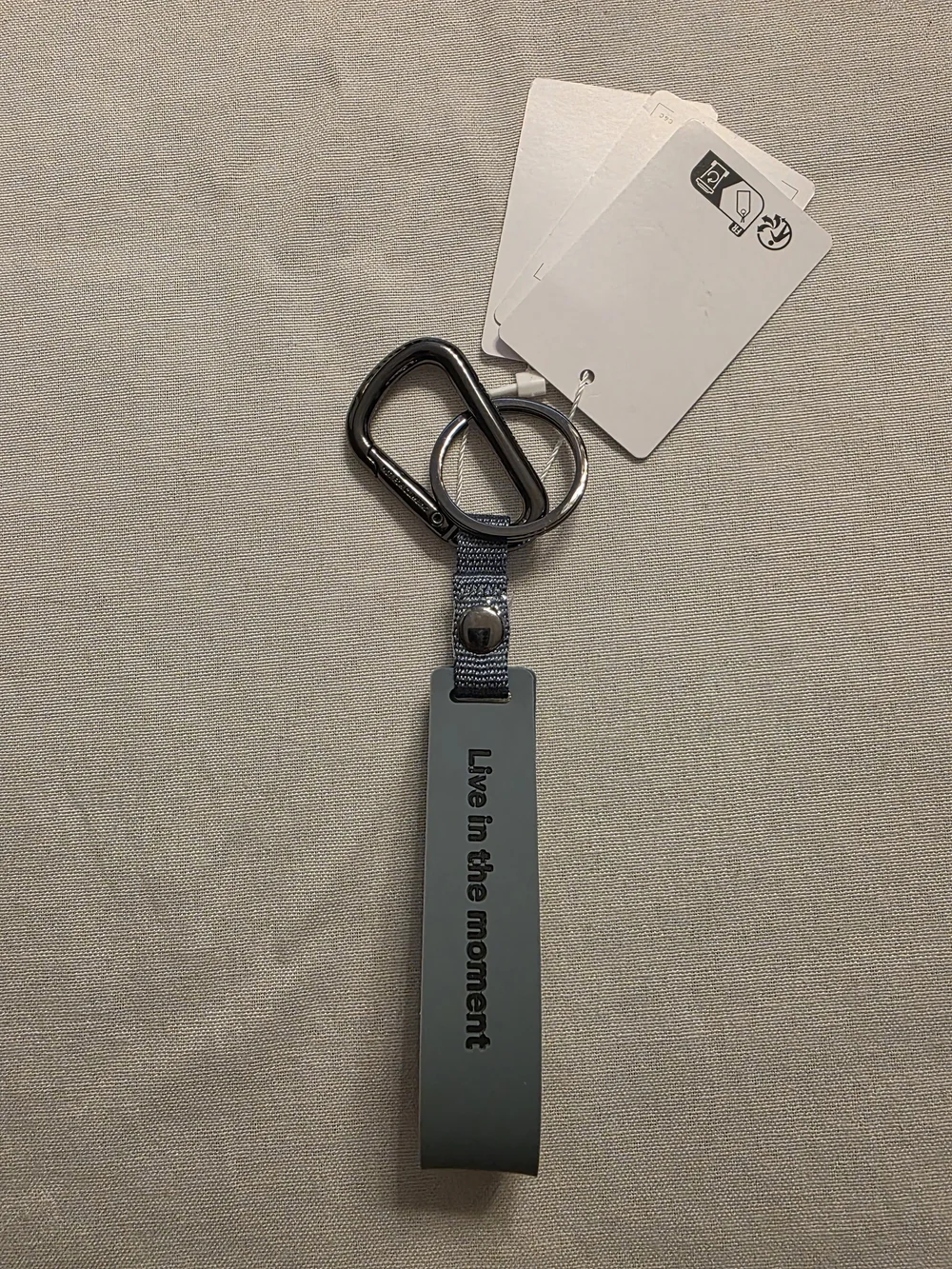 lululemon athletica Silicone Key Fob in Gray-Blue with Metal Ring.